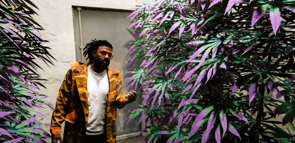 Lu Hawk standing in a grow room